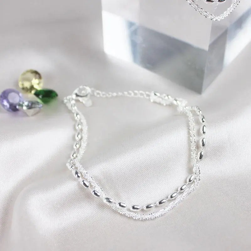 Set di bracciali eleganti in argento con pietre di zirconia